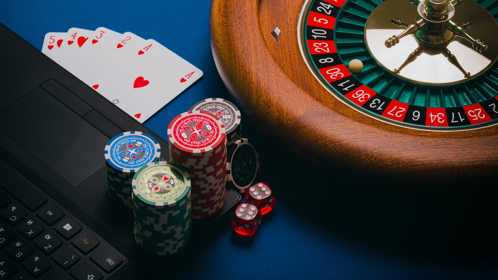 Roulette table with chips, cards, dice, and gaming layout details